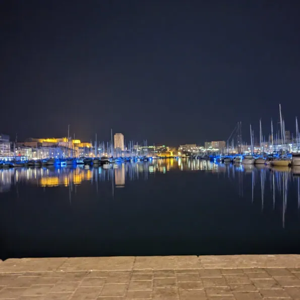 A nighttime view of Marseilles harbour near the hackfest event.